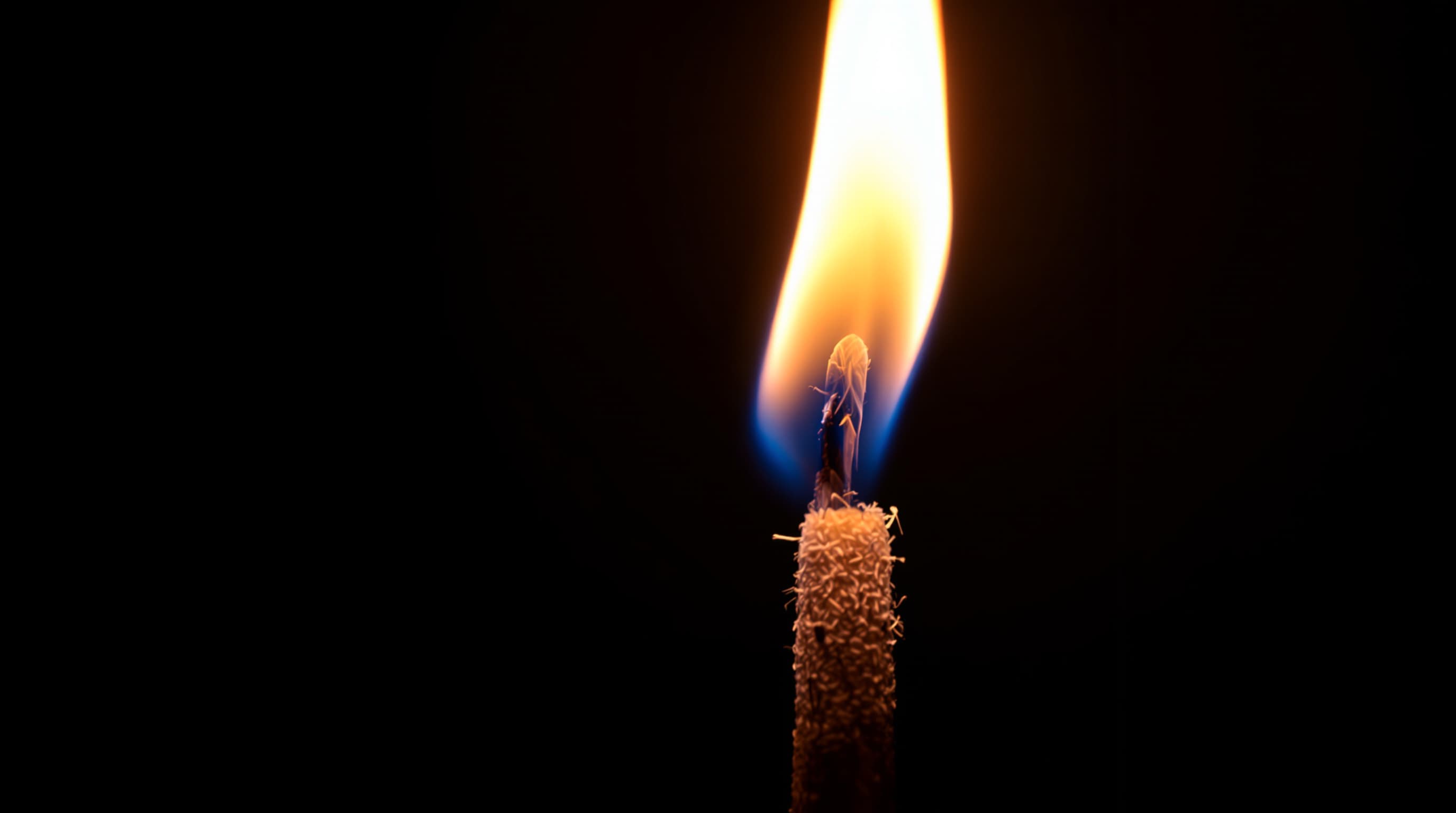 Natural hemp wick burning with a steady tall flame