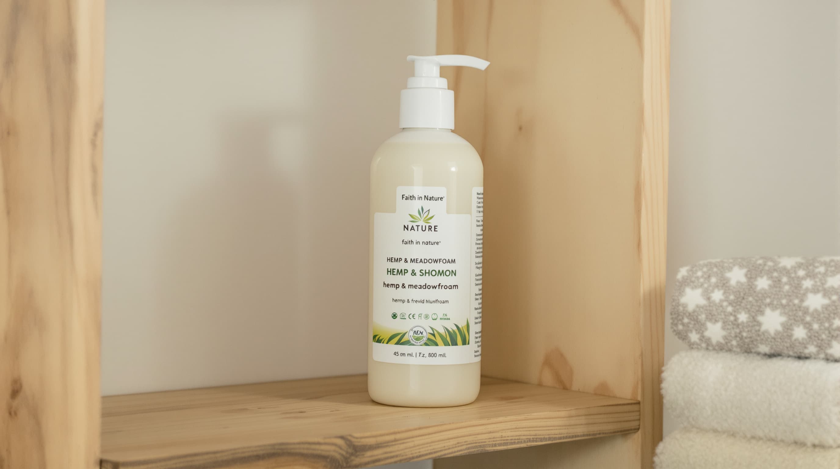 Faith in Nature hemp shampoo bottle on bathroom shelf